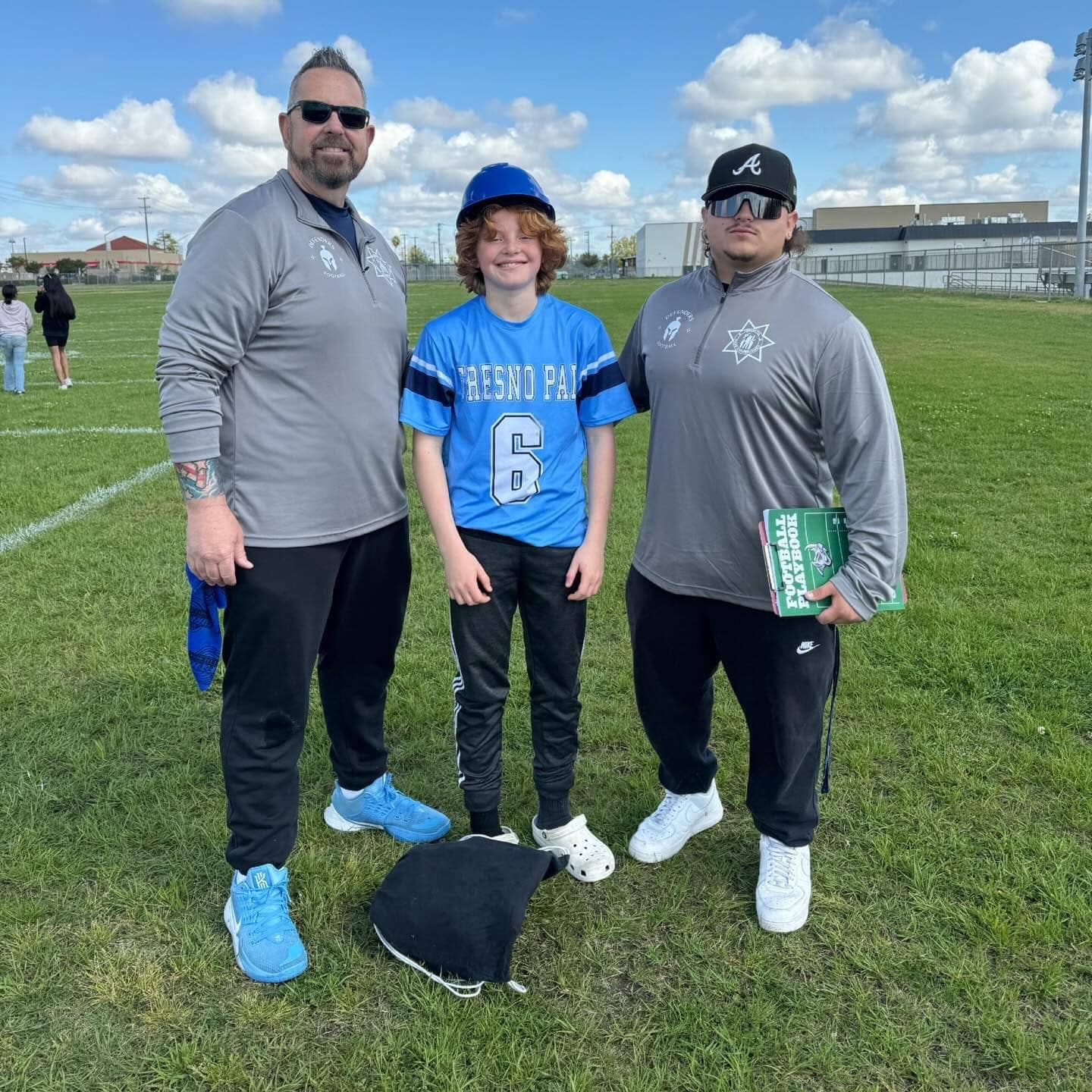 Fresno PAL flag football coaches and player